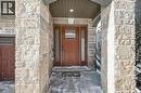 Property entrance featuring stone siding