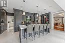 Chef's Kitchen with Illuminated Display Cabinetry