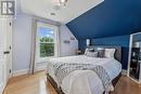 Third Bedroom with Hardwood Flooring