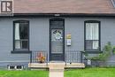 Doorway to property featuring brick siding