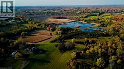Drone / aerial view of a large body of water and a forest