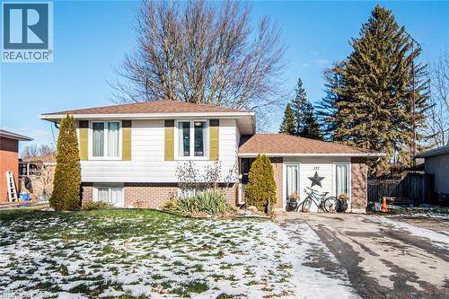 Split level home with brick siding
