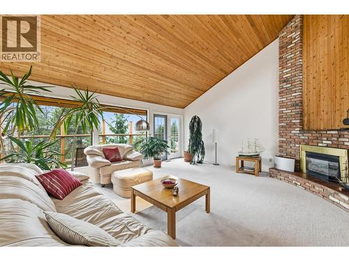 Large windows framing the lake views & patio access