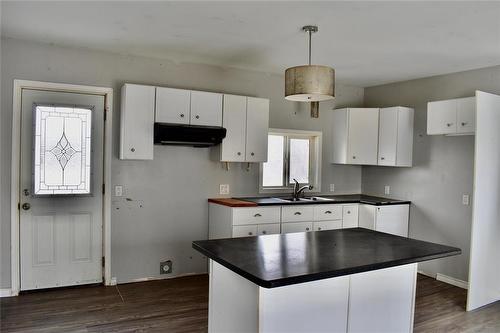 Large eat in kitchen with an abundant source of natural light