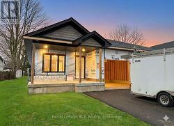 Virtually enhanced to show driveway/lawn/lighting