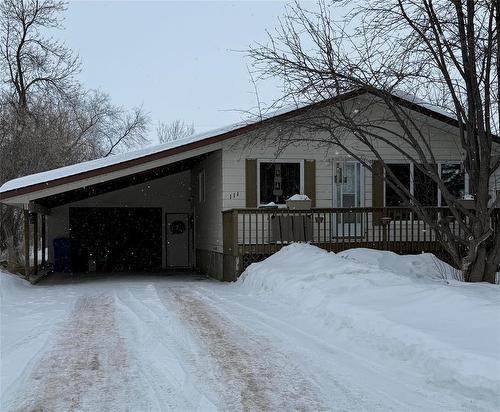 Welcome Home!  Notice the Railed deck in front of the house