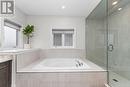 Soaking tub with glass walk in shower