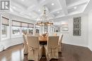 Dining Room with coffered ceiling and pot lighting