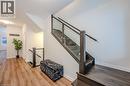 Stairway featuring wood finished floors and baseboards