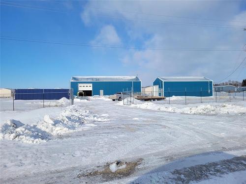 Entrance view of the buildings and acreage