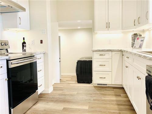 Main level full size kitchen with under cabinetry lighting.Each level has a dishwasher.