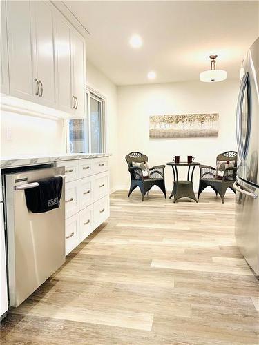 Another view of main level kitchen looking out to the dining area just around the corner from the main level living room.