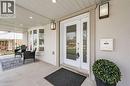 Property entrance featuring french doors