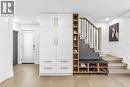 Stairway with hardwood / wood-style flooring and recessed lighting