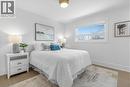 Bedroom featuring baseboards and light wood-style flooring