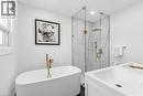 Primary Ensuite with a marble finish shower, double vanity, a freestanding bath, and recessed lighting