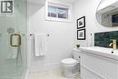 4th bathroom (basement) with a stall shower, vanity, and tasteful backsplash