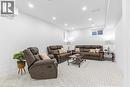 Living room featuring recessed lighting and baseboards