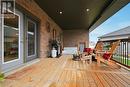 Covered back deck with hot tub