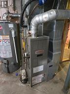Utility room with heating unit and gas water heater