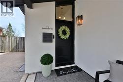 View of exterior entry with stucco siding