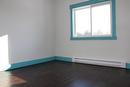 Spare bedroom with lot's of natural light. This room also has new flooring, window and ceiling fan.