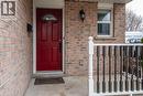 Entrance to property with brick siding