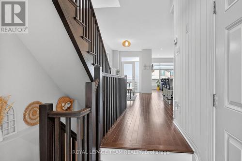 Foyer with a beautiful wood panel feature wall.