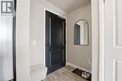 Entrance foyer with light wood-style flooring and baseboards
