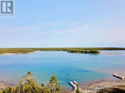 183 feet of pristine shoreline with deep water.