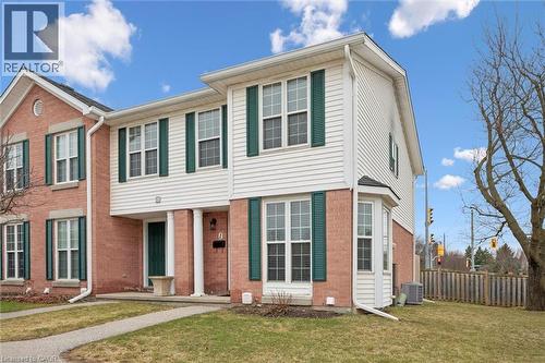 View of front of property with brick siding and covered porch