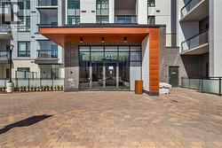Doorway to property featuring brick siding