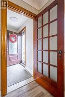 Entrance foyer featuring light wood-style floors and baseboards