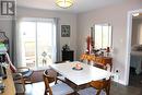 Dining room w/patio doors to deck and fenced yard