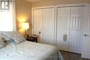 Primary bedroom on main floor w/his & hers closets