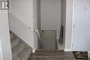 stairs kitchen to living room garage door on right