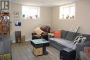 Basement rec room with large windows