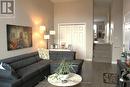 Living room and stairs to kitchen