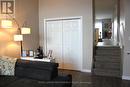 Living room closets and 4 steps up  to kitchen