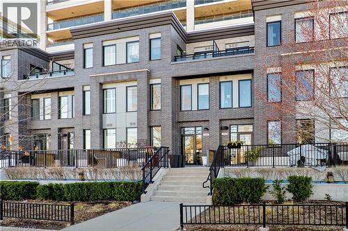 The property features a multi-story exterior with dark brickwork and prominent windows