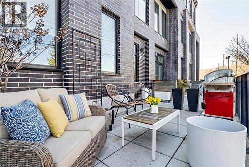 This property features an outdoor patio with brick exterior, offering an inviting space for relaxation or entertaining