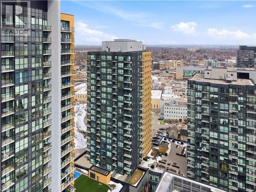 This high-rise property features a modern exterior with expansive windows and private balconies