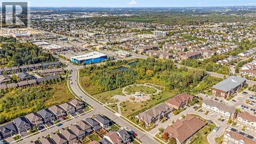 Aerial overview of property's location featuring nearby suburban area