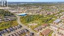 Aerial overview of property's location featuring nearby suburban area