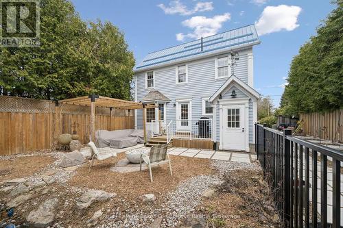 MAIN HS: Back of home, deck, landscaped backyard