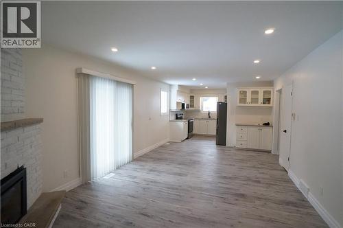 Open-concept living area with wood-finish flooring
