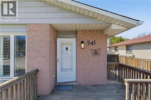 Brick facade with light gray siding and white soffits