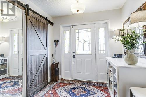 Ample Foyer with Barn door