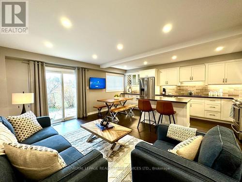 Open concept living, kitchen & dining.