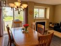 Dining area with hardwood and sliding door to bbq